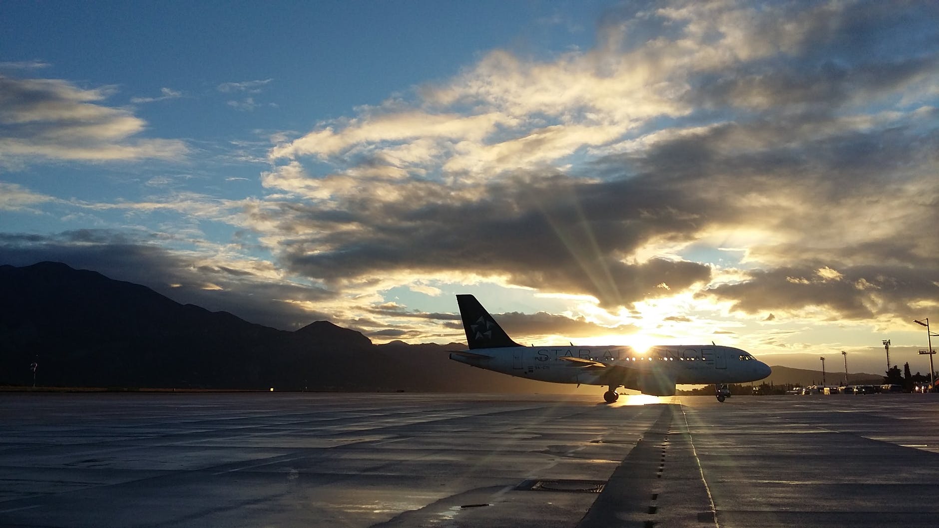 silhouette of airplane in golden hour