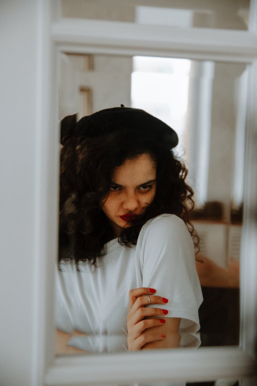 reflection of angry woman in mirror